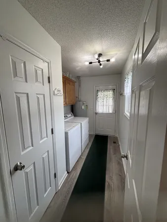 a view of entryway with stairs and wooden floor
