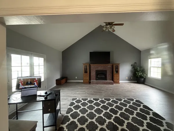a living room with furniture and a fireplace