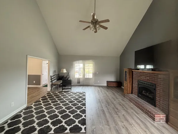 a living room with furniture and a fireplace