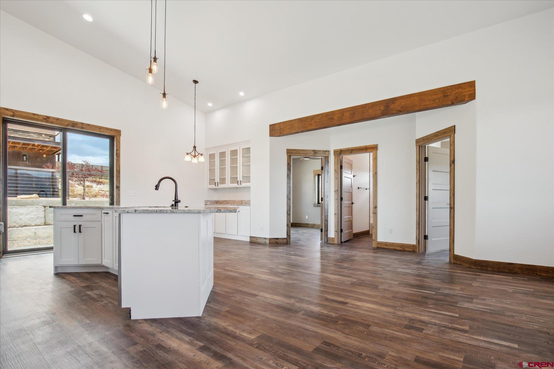 8847 Road 26.7 Cortez, CO 81321 - Photo 16 of 29 a view of kitchen with cabinets and wooden floor
