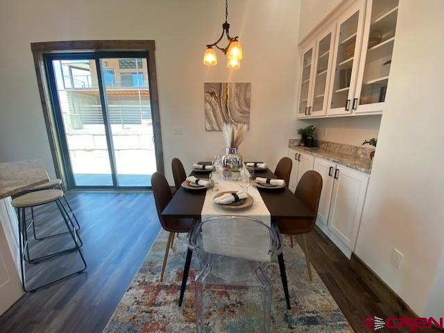 8847 Road 26.7 Cortez, CO 81321 - Photo 6 of 29 a view of a workspace with furniture and a window