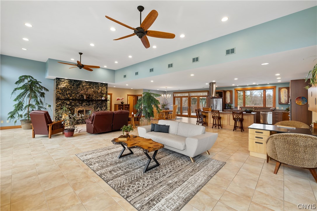 6687 Beach Road Camillus, NY 13209 - Photo 11 of 50 Front windows have remote control custom blinds.