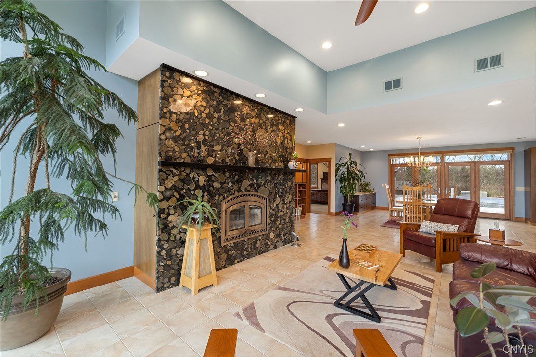 6687 Beach Road Camillus, NY 13209 - Photo 12 of 50 Wood burning fireplace with riverbed granite. Hidd