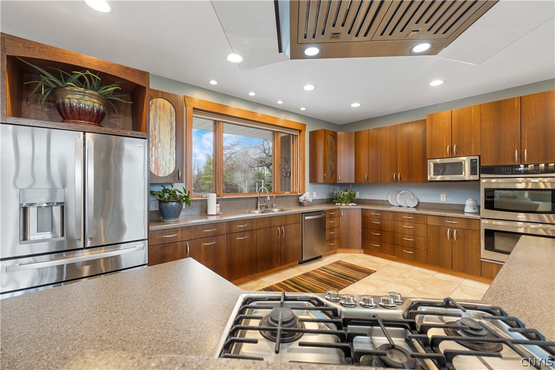 6687 Beach Road Camillus, NY 13209 - Photo 15 of 50 Corian counters, 5 burner cooktop, double ovens, p