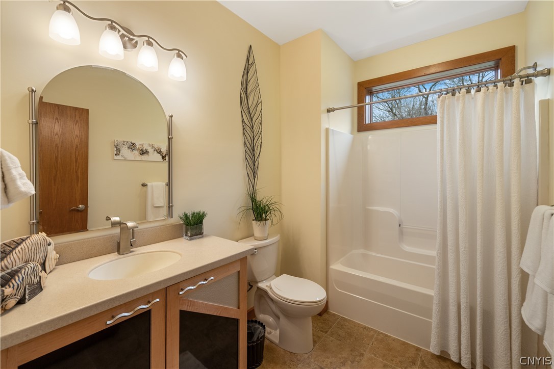 6687 Beach Road Camillus, NY 13209 - Photo 25 of 50 Full bath sits between Bedrooms 2 and 3.