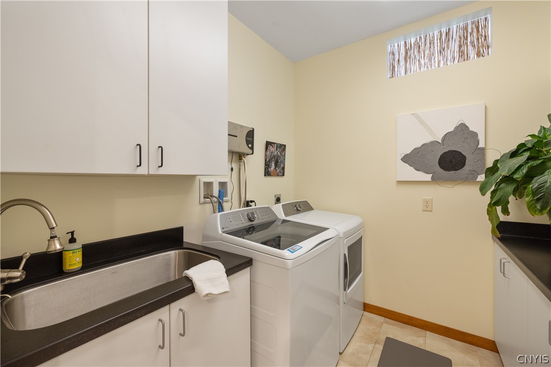 6687 Beach Road Camillus, NY 13209 - Photo 27 of 50 Laundry room with stainless slop sink, pocket door
