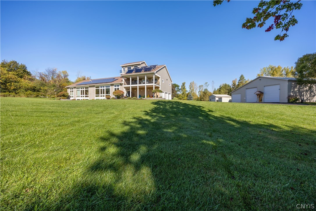 6687 Beach Road Camillus, NY 13209 - Photo 4 of 50 Solar panels provide green energy that keep this h