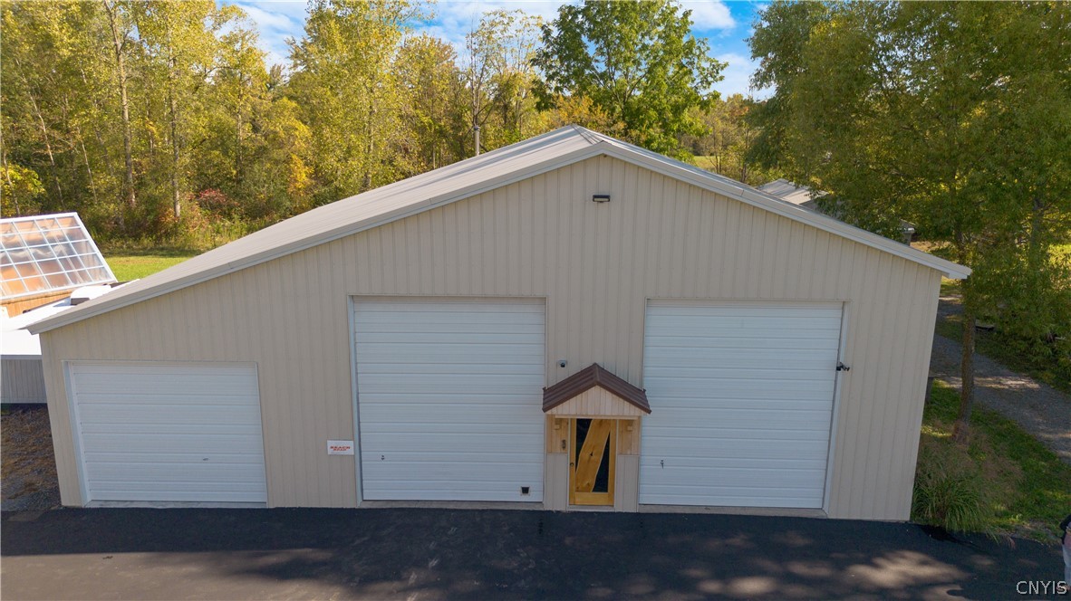 6687 Beach Road Camillus, NY 13209 - Photo 45 of 50 2 Oversized doors plus 3rd bay offer lots of room