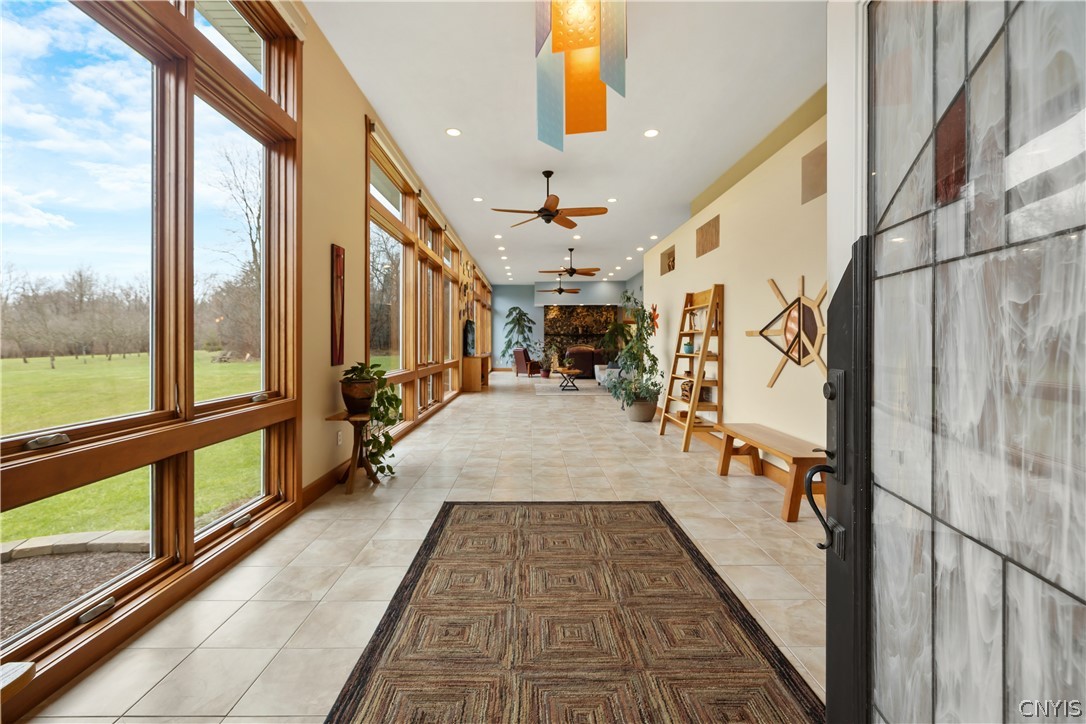 6687 Beach Road Camillus, NY 13209 - Photo 9 of 50 13 foot ceilings and breathtaking wall of windows