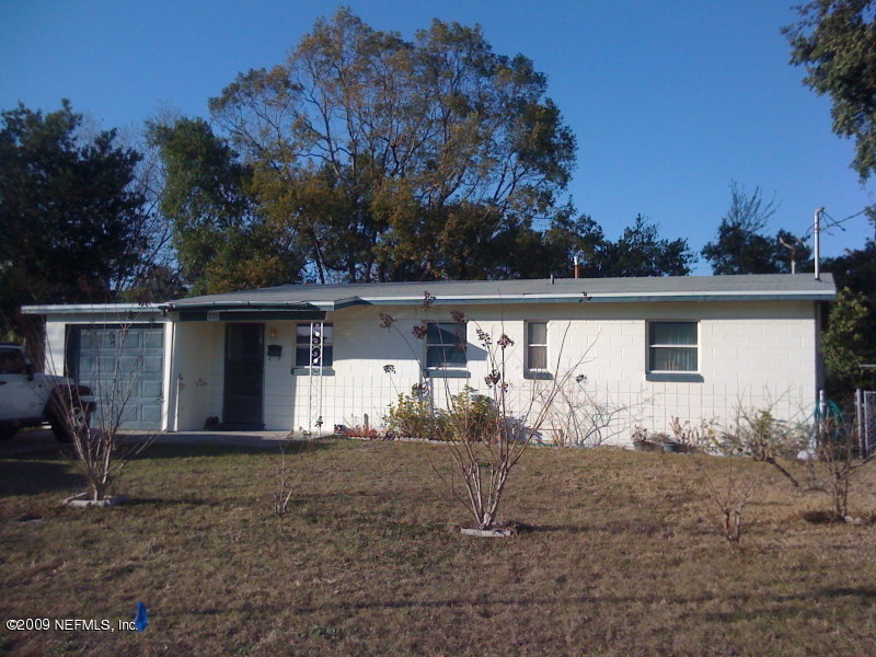 733 Vecuna Road Atlantic Beach, FL 32233 - Photo 1 of 1 front view of a house with a yard