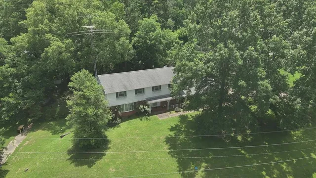 a view of a house with a tree