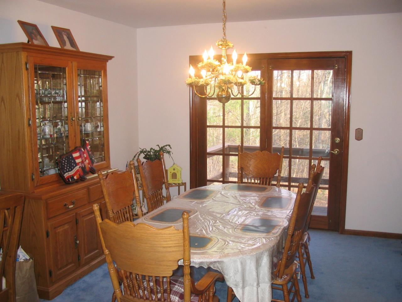 5 Woods Road East Stroudsburg, PA 18301 - Photo 3 of 8 a view of a dining room with furniture a chandelier and wooden floor