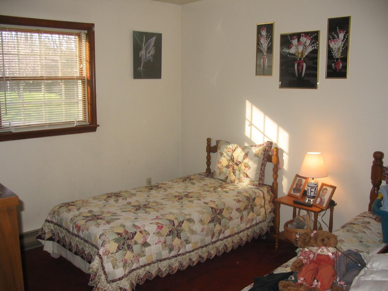 5 Woods Road East Stroudsburg, PA 18301 - Photo 6 of 8 a bedroom with a bed and wooden floor