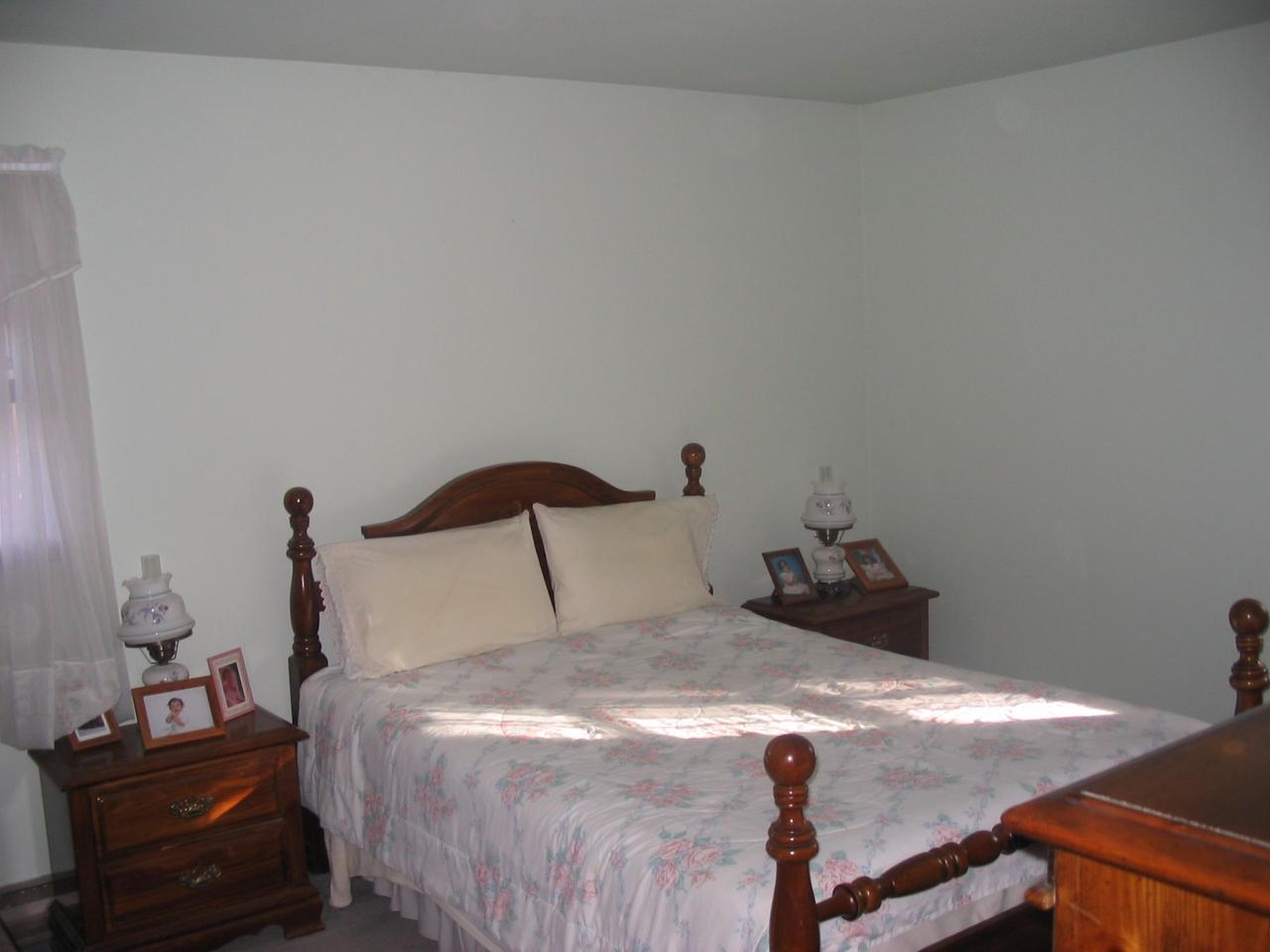 5 Woods Road East Stroudsburg, PA 18301 - Photo 8 of 8 a bedroom with a bed and a lamp on the dresser