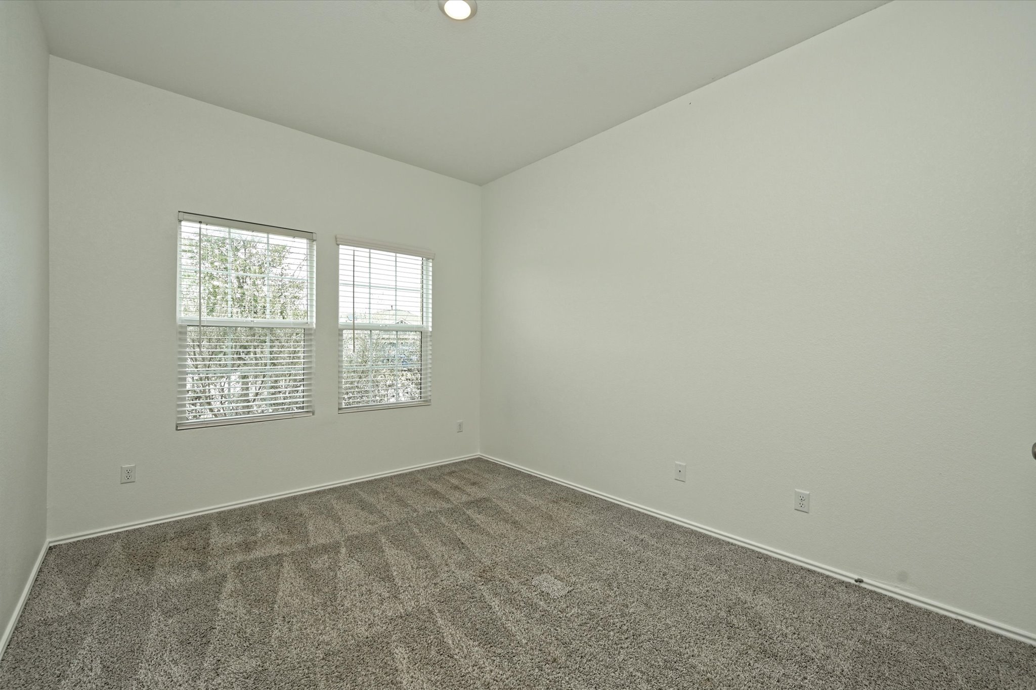 180 Madrid Kyle, TX 78640 - Photo 20 of 32 an empty room with a window