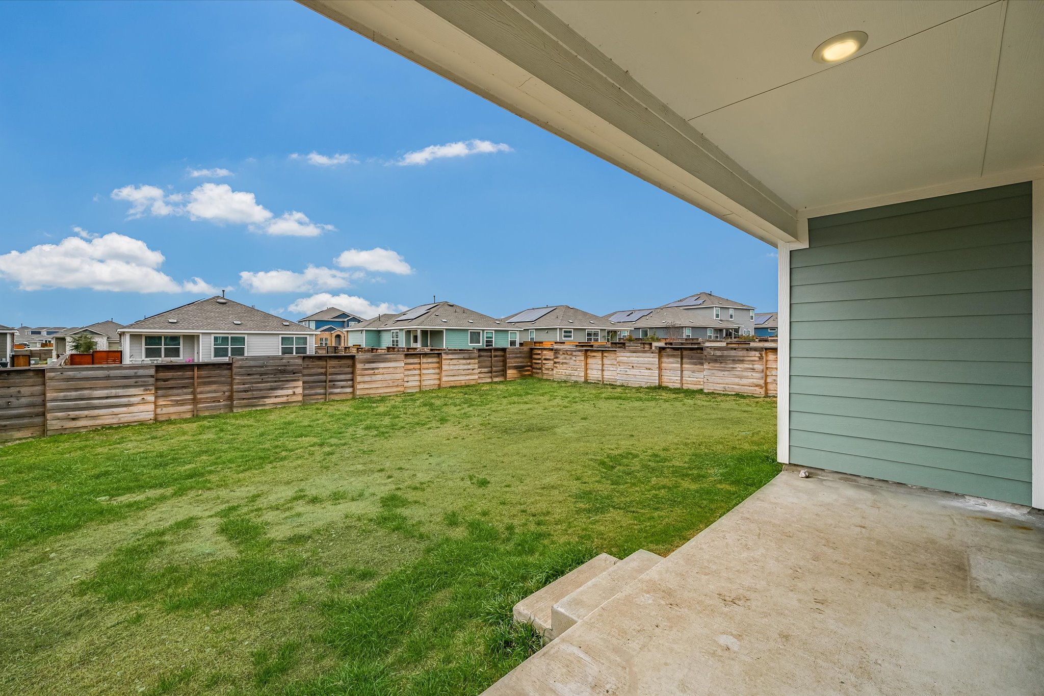 180 Madrid Kyle, TX 78640 - Photo 28 of 32 a view of an house with backyard space and balcony