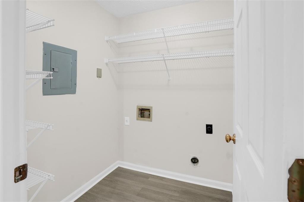 235 Bentley Place Tucker, GA 30084 - Photo 12 of 22 a view of a hallway with wooden floor