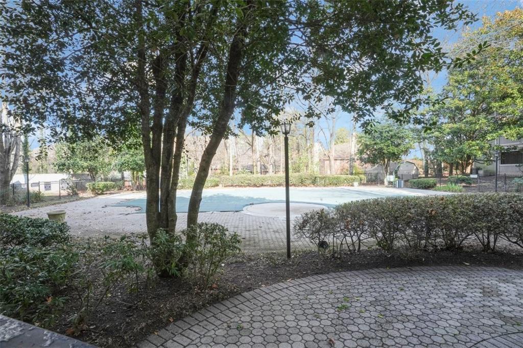 235 Bentley Place Tucker, GA 30084 - Photo 20 of 22 a view of a yard with plants and trees