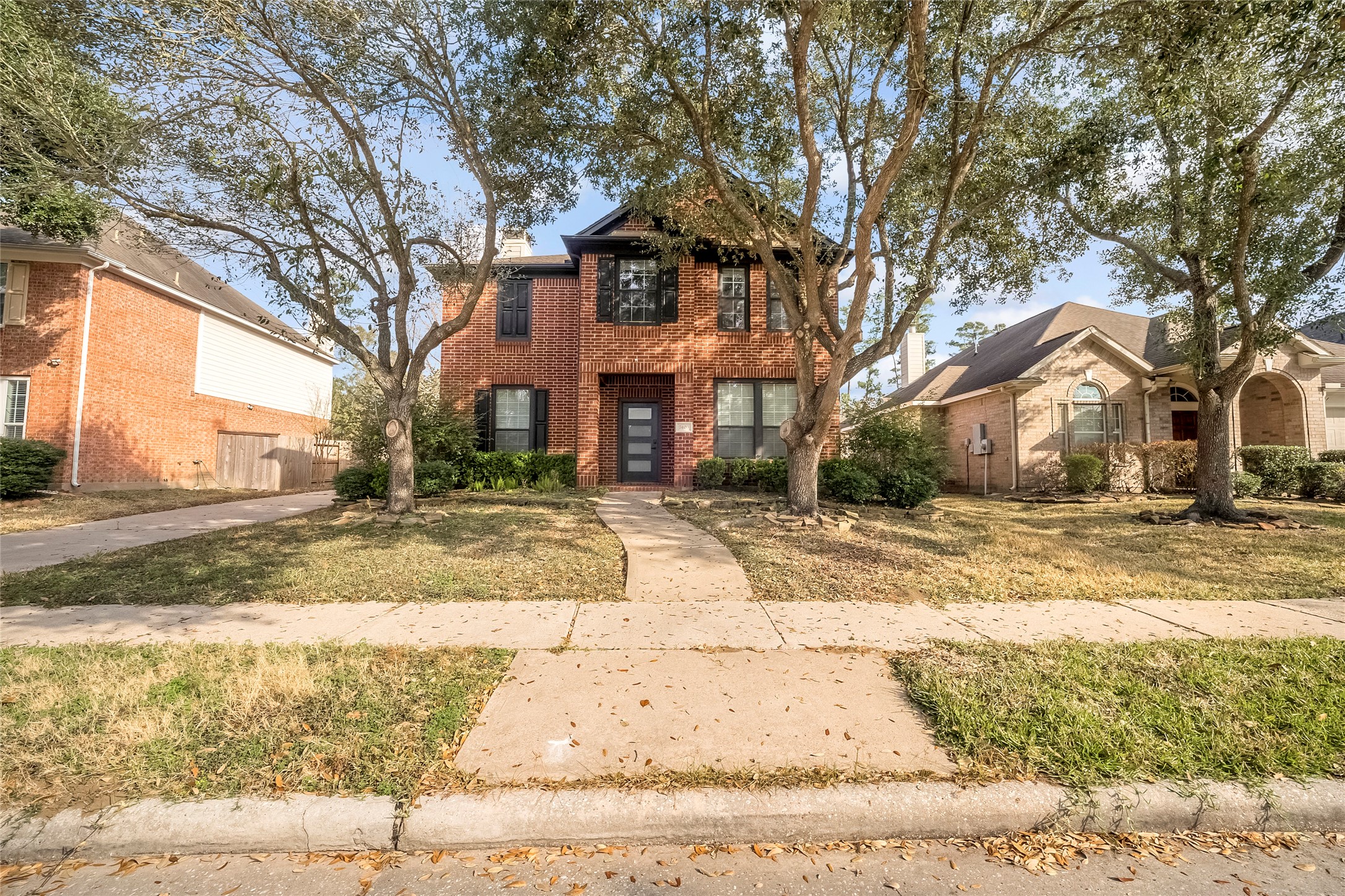 7403 Fall Springs Lane Humble, TX 77396 - Photo 1 of 16 a front view of house with yard