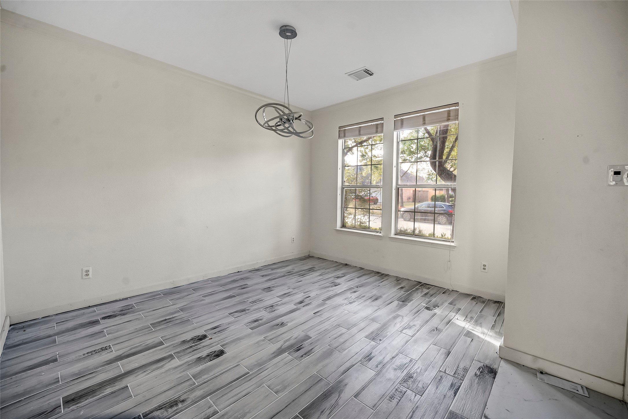 7403 Fall Springs Lane Humble, TX 77396 - Photo 13 of 16 a view of room with window and wooden floor