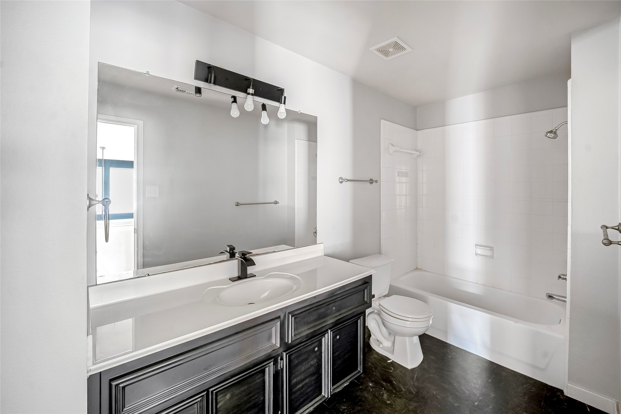 7403 Fall Springs Lane Humble, TX 77396 - Photo 14 of 16 a bathroom with a sink a toilet and shower