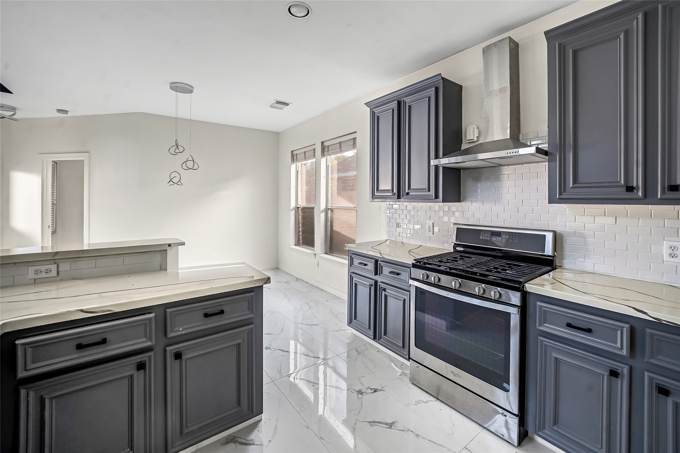 7403 Fall Springs Lane Humble, TX 77396 - Photo 6 of 16 a kitchen with granite countertop a stove and a sink