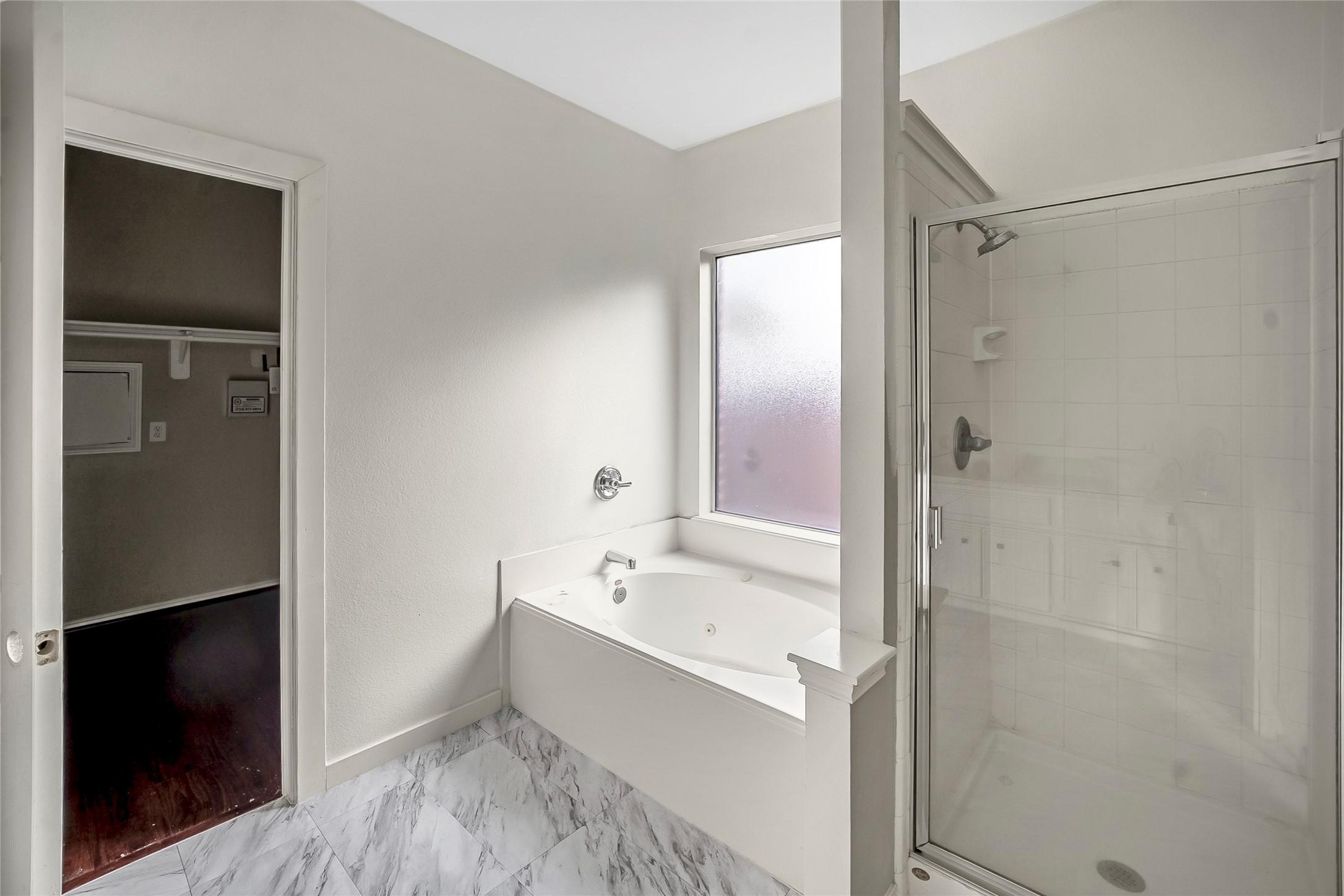 7403 Fall Springs Lane Humble, TX 77396 - Photo 8 of 16 a bathroom with a tub shower and sink