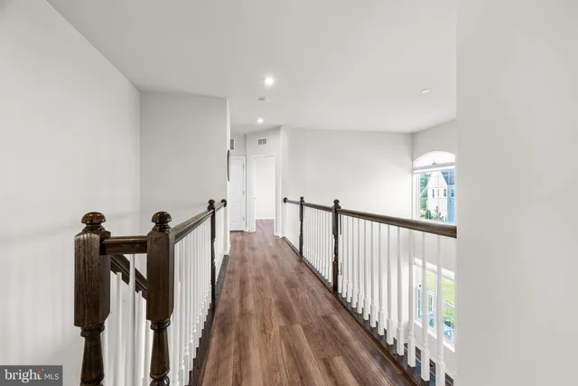 a view of a hallway with a large window