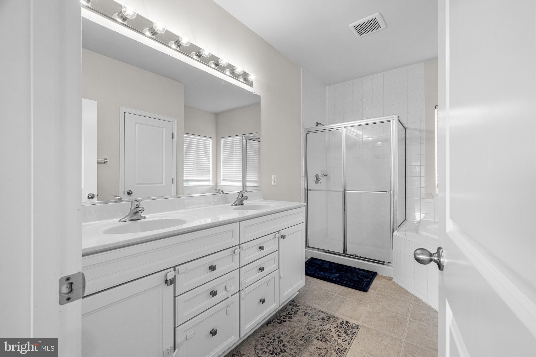 1022 Fawn Haven Walk Dover, DE 19901 - Photo 25 of 46 a spacious bathroom with a double vanity sink mirror and double