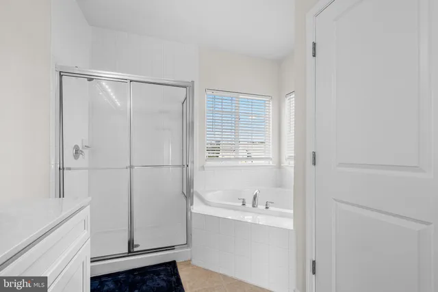 a bathroom with a bathtub and sink