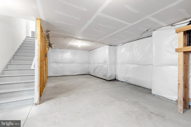 a view of empty room with stairs