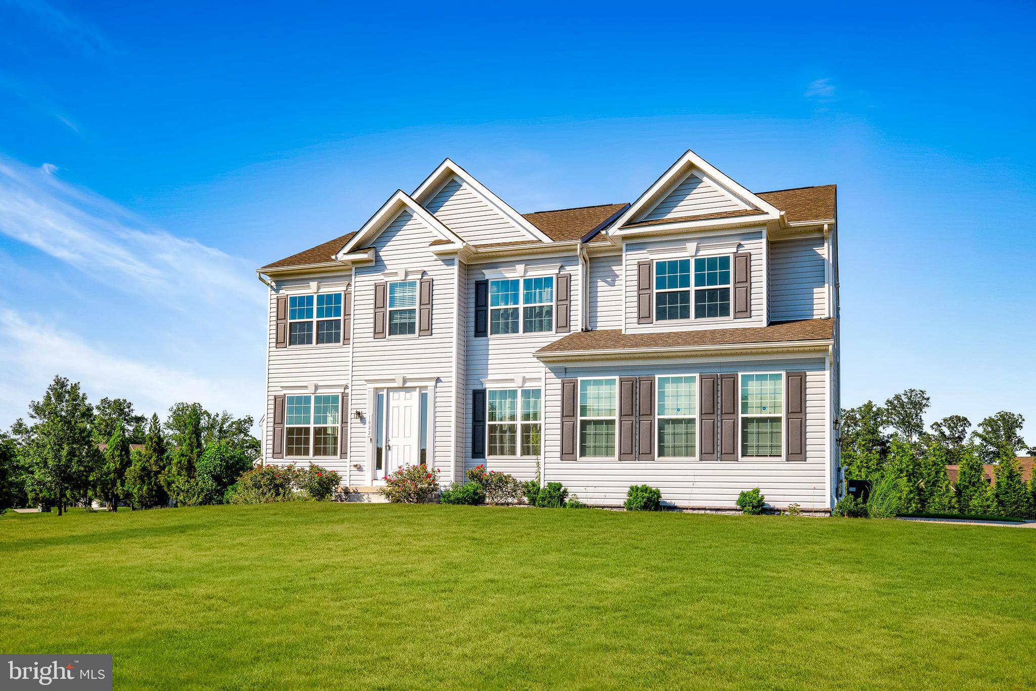 1022 Fawn Haven Walk Dover, DE 19901 - Photo 4 of 46 a front view of a house with a garden