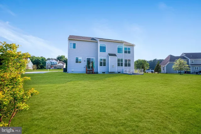 a view of a house with a big yard