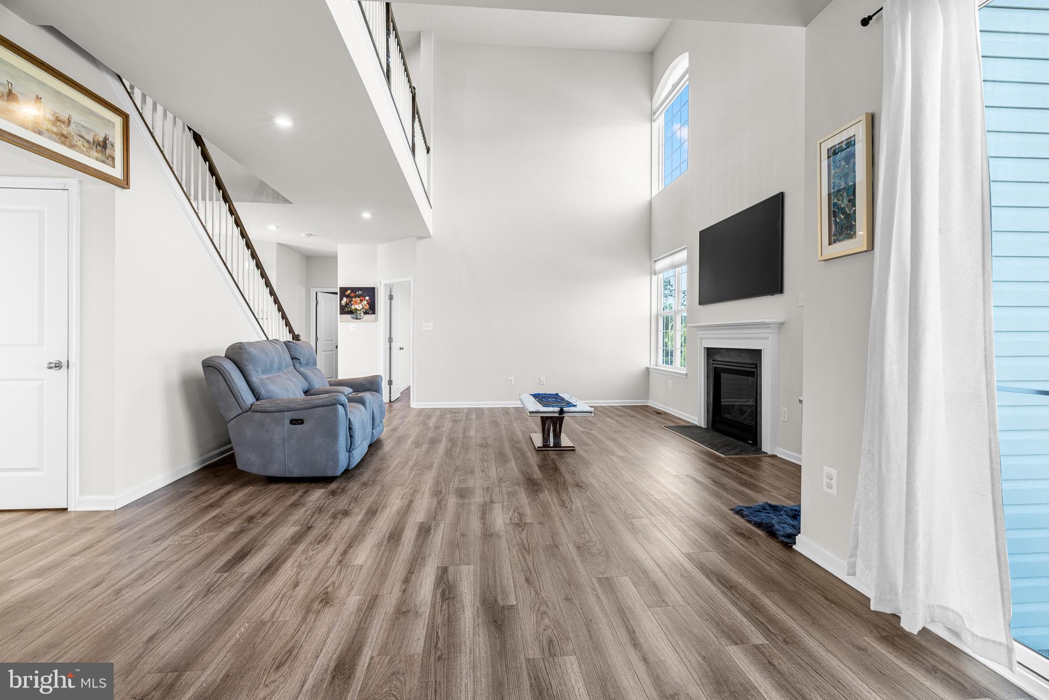 1022 Fawn Haven Walk Dover, DE 19901 - Photo 6 of 46 a living room with furniture and a wooden floor