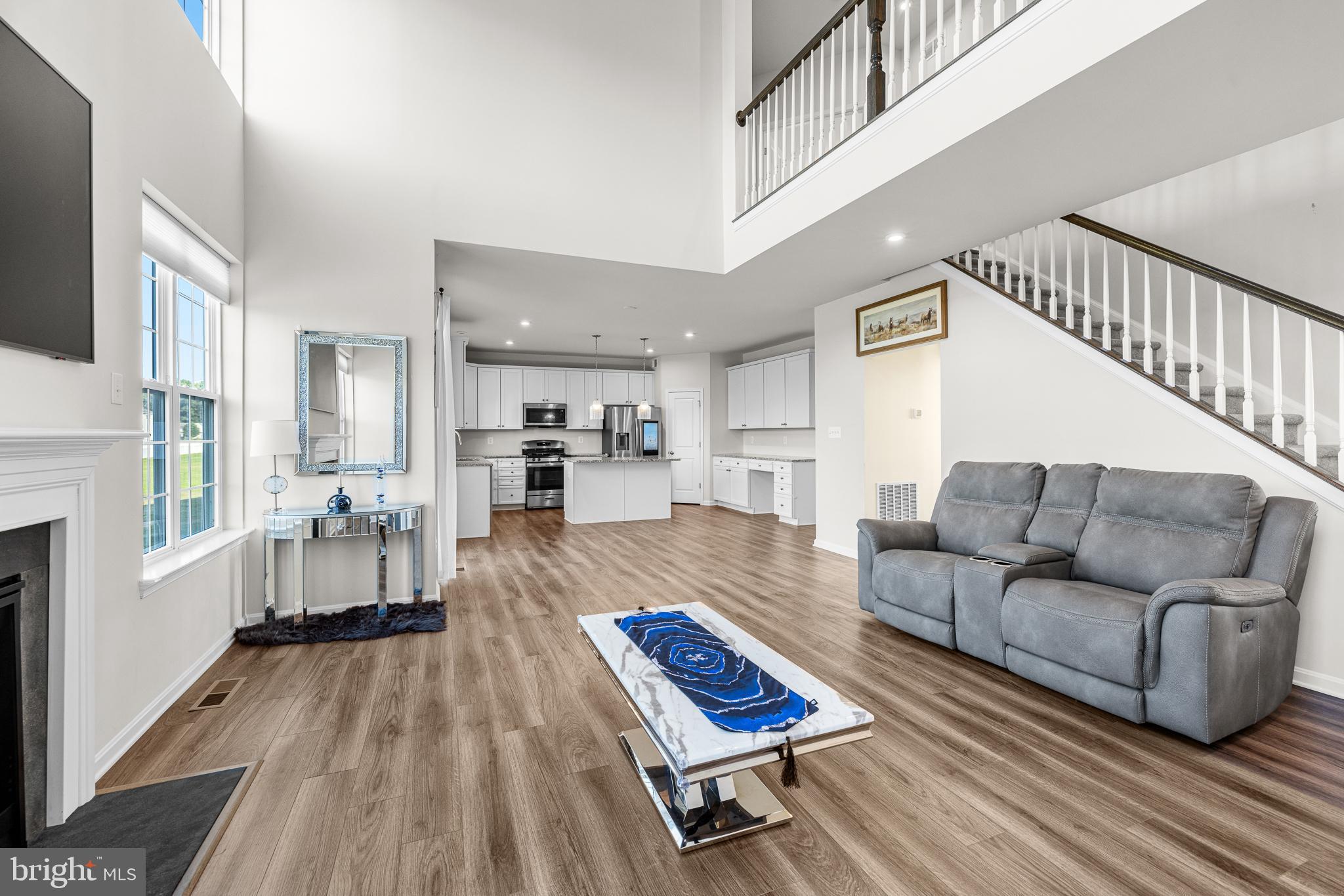 1022 Fawn Haven Walk Dover, DE 19901 - Photo 7 of 46 a living room with furniture and a wooden floor