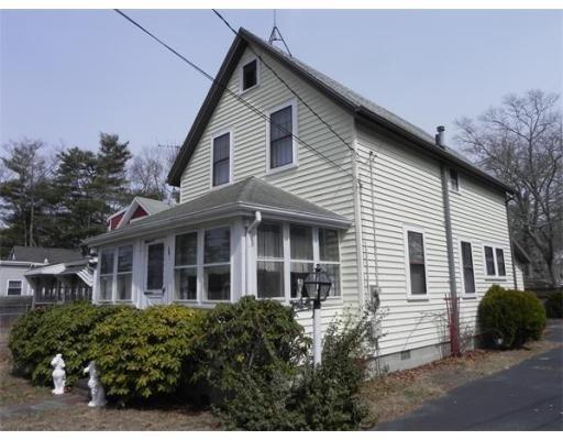 142 Swifts Beach Road Wareham, MA 02571 - Photo 1 of 10 a view of a white house next to a yard