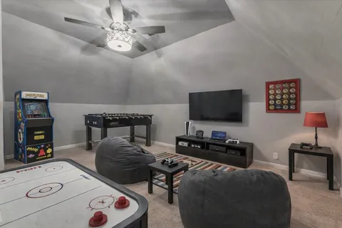 a bedroom with furniture and a flat screen tv