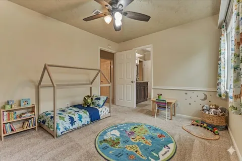 a bedroom with furniture and a chandelier