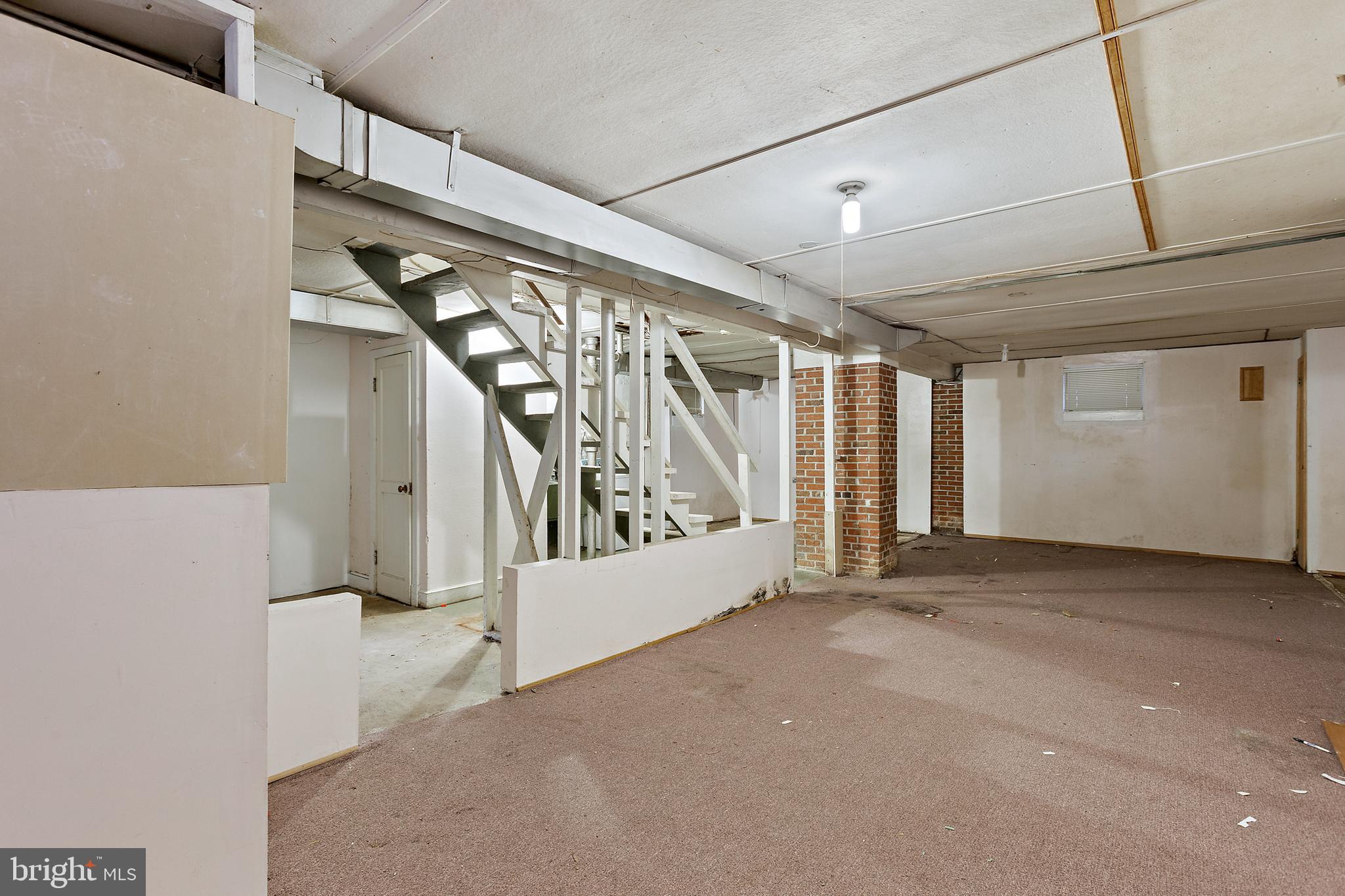 5913 Rolston Road Bethesda, MD 20817 - Photo 10 of 37 a view of an empty room with stairs