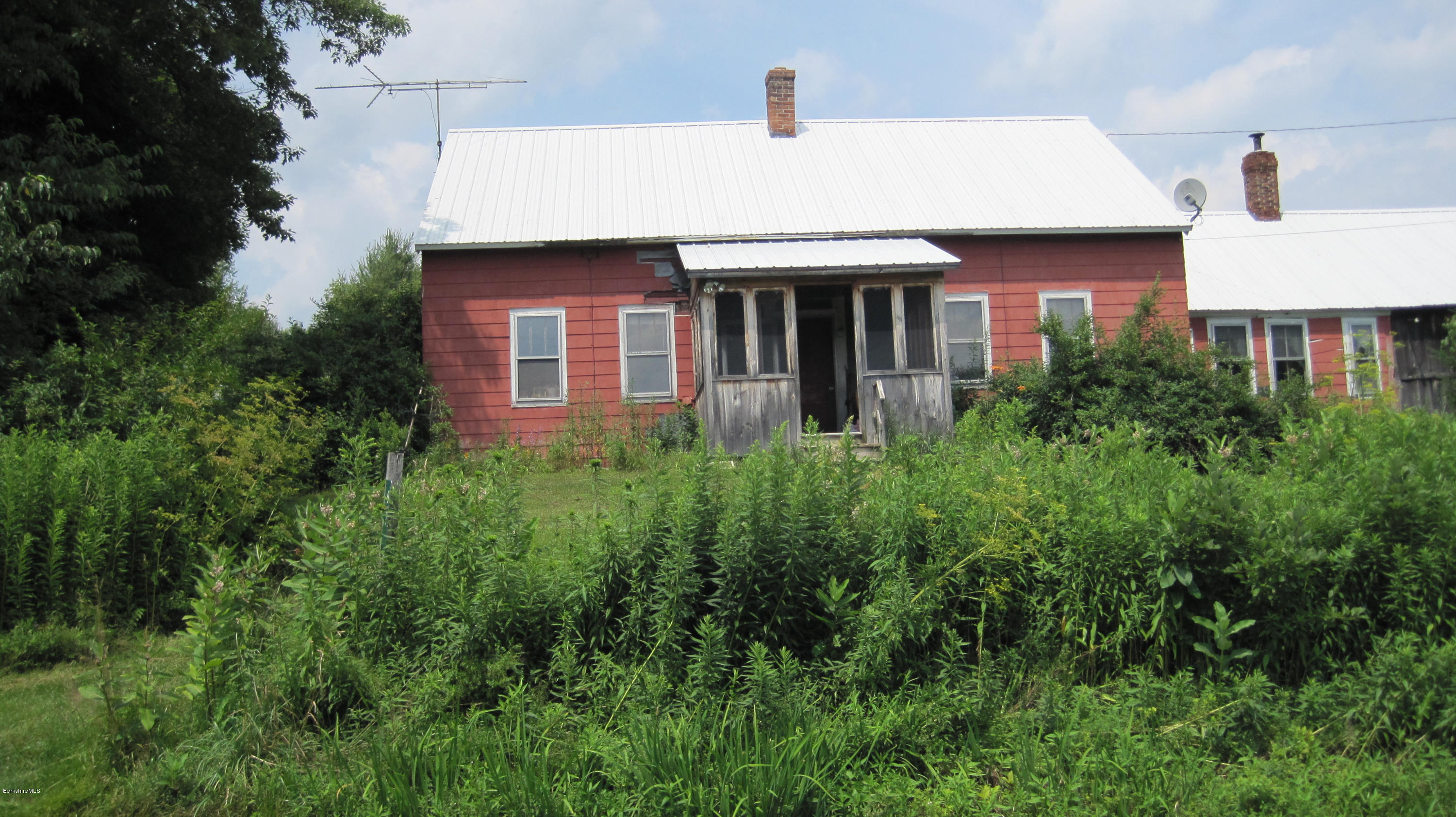 67 Briar Road Savoy, MA 01256 - Photo 1 of 6 a view of a house in front of a yard with potted plants