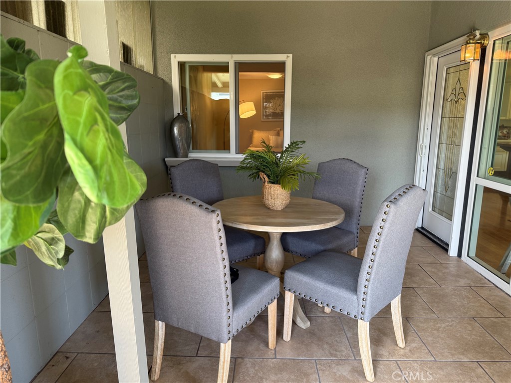1670 Interlachen Road Seal Beach, CA 90740 - Photo 23 of 23 a view of a dining room with furniture and a potted plant