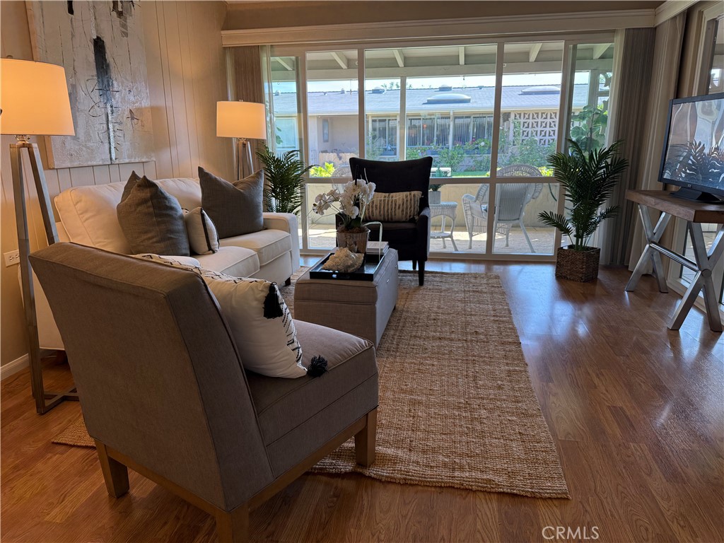 1670 Interlachen Road Seal Beach, CA 90740 - Photo 6 of 23 a living room with furniture and floor to ceiling window
