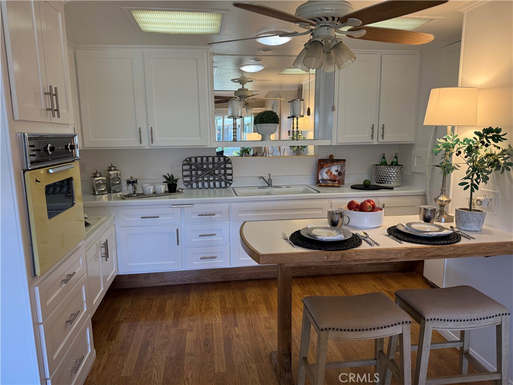 1670 Interlachen Road Seal Beach, CA 90740 - Photo 7 of 23 a kitchen with sink and cabinets
