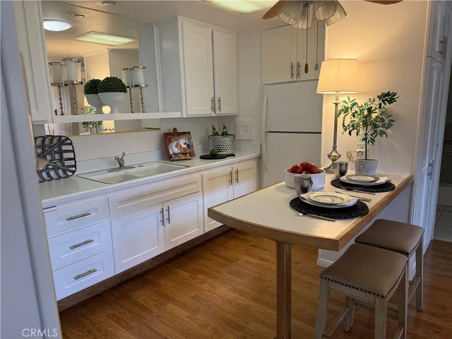 a kitchen with sink and cabinets