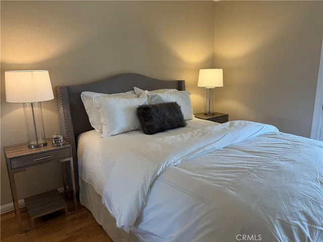 a bedroom with a bed and a lamp