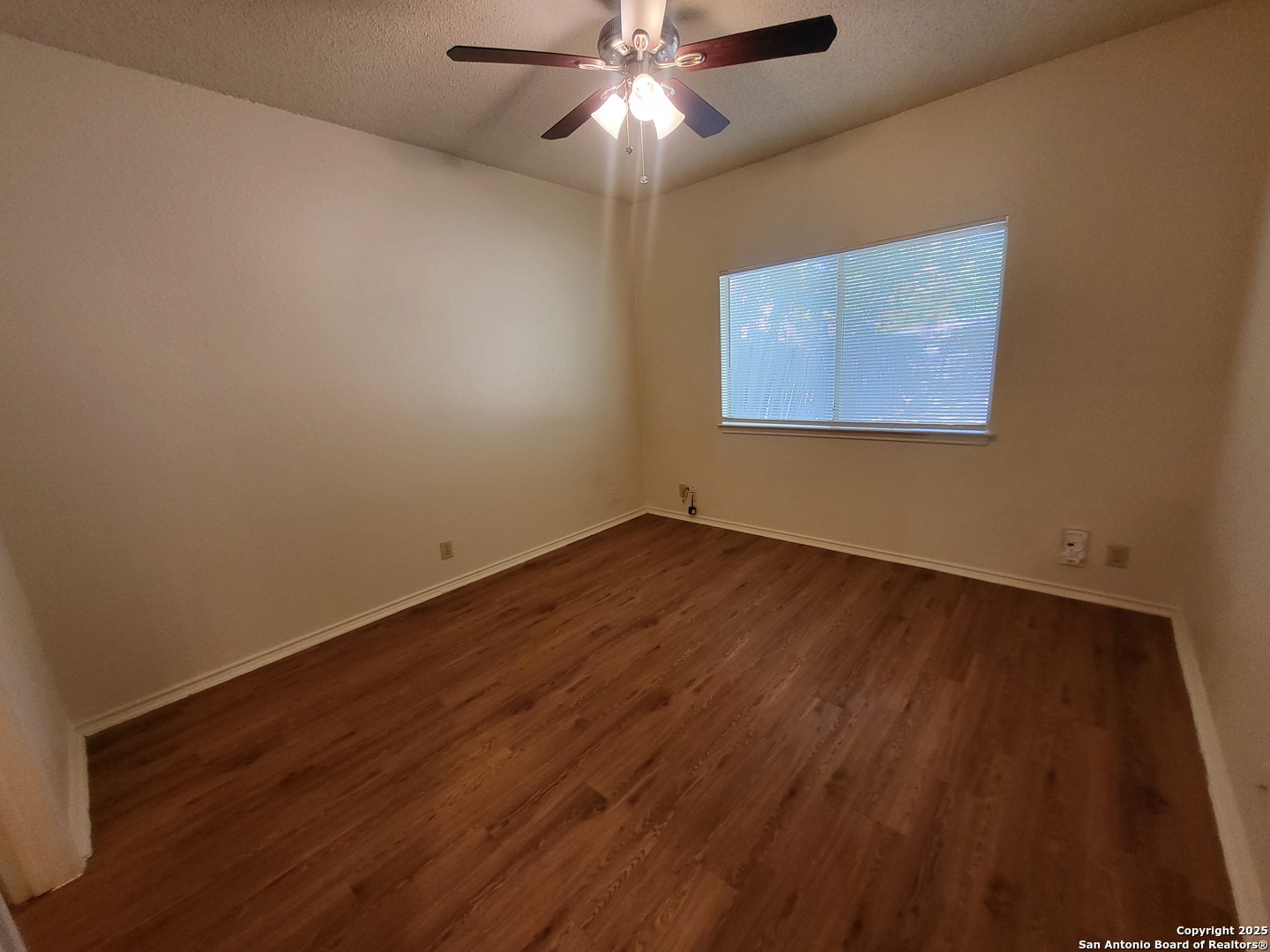 3405 Ridge Smoke San Antonio, TX 78247 - Photo 13 of 16 a view of a room with wooden floor and chandelier fan