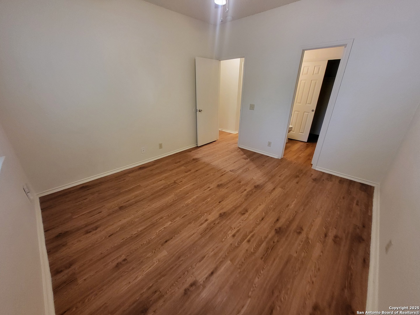 3405 Ridge Smoke San Antonio, TX 78247 - Photo 14 of 16 an empty room with wooden floor and a sink