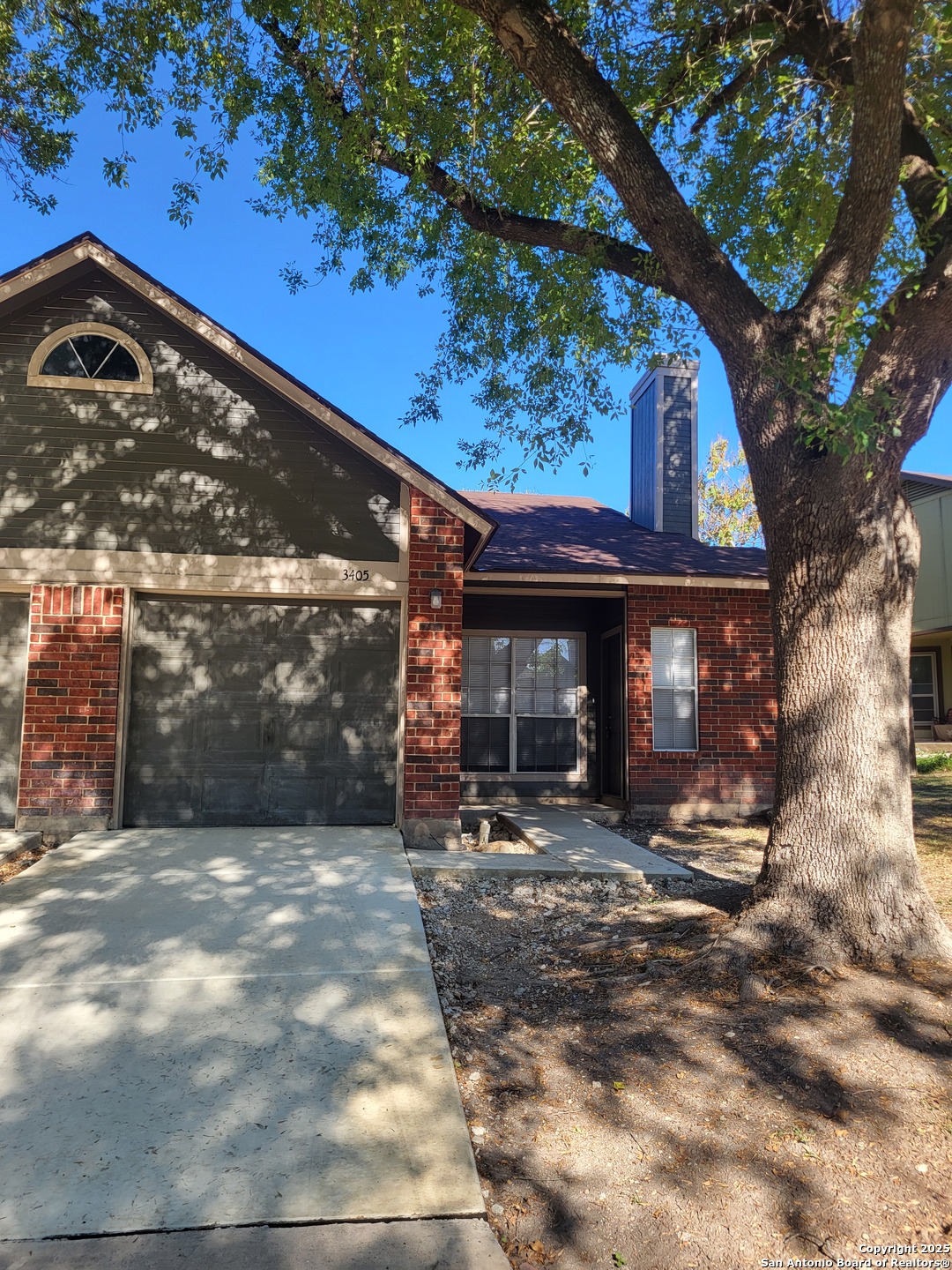 3405 Ridge Smoke San Antonio, TX 78247 - Photo 2 of 16 a view of a house with a tree