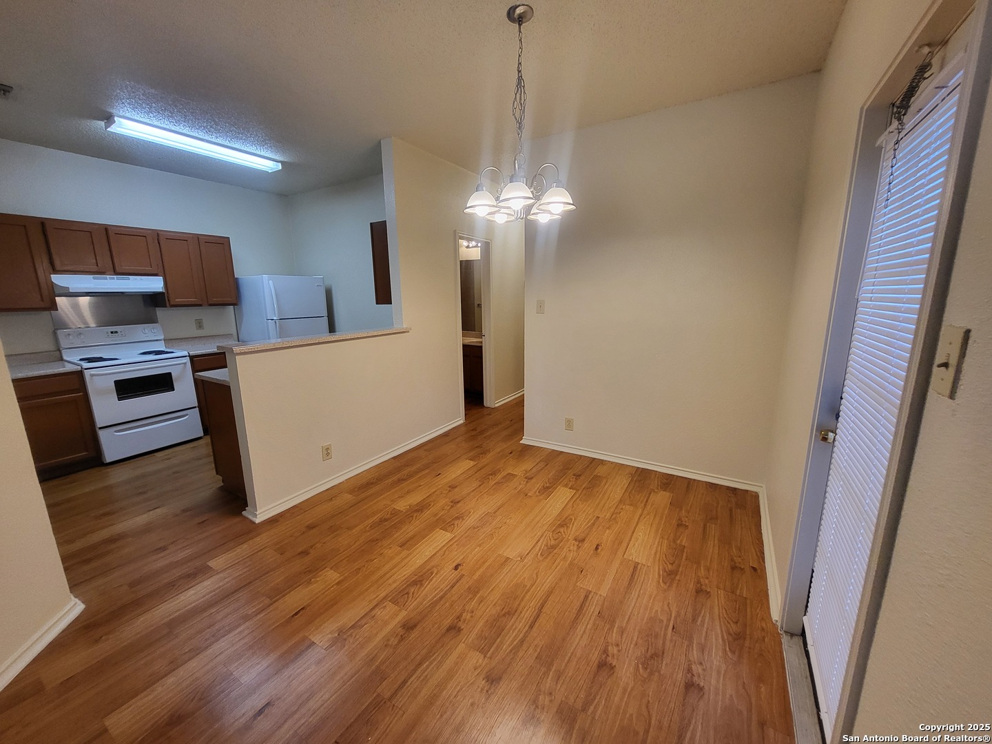 3405 Ridge Smoke San Antonio, TX 78247 - Photo 5 of 16 a view of a kitchen with microwave and cabinets