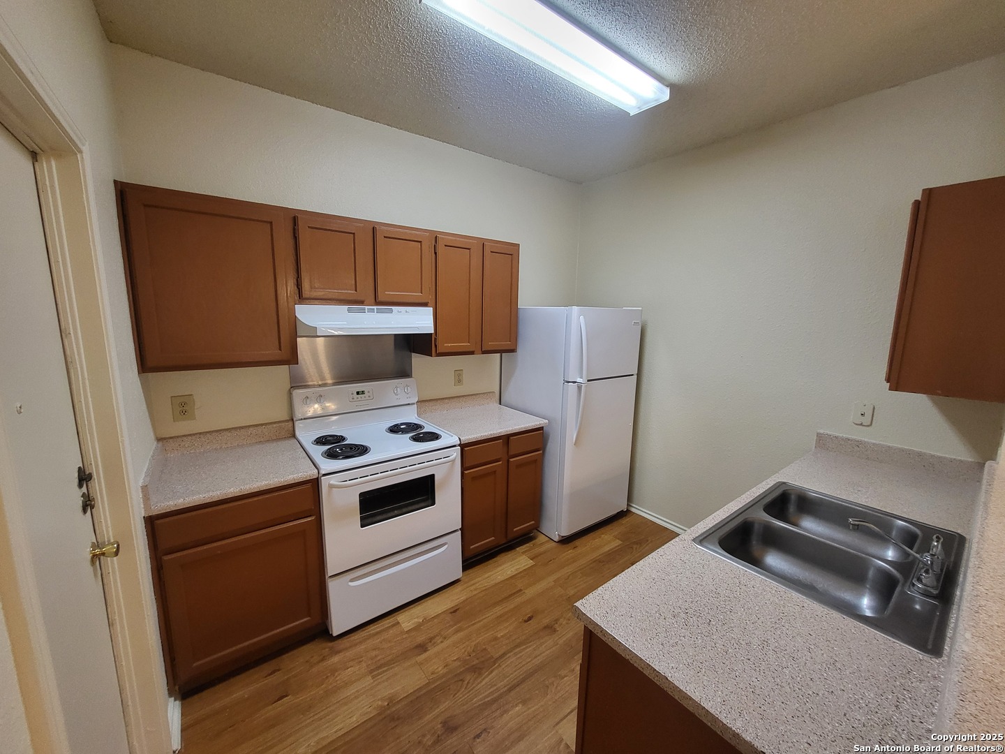 3405 Ridge Smoke San Antonio, TX 78247 - Photo 6 of 16 a kitchen with a stove and a microwave